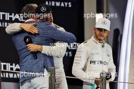 (L to R): David Coulthard (GBR) Red Bull Racing and Scuderia Toro Advisor / Channel 4 F1 Commentator with World Champion Nico Rosberg (GER) Mercedes AMG F1 and Lewis Hamilton (GBR) Mercedes AMG F1 on the podium. 27.11.2016. Formula 1 World Championship, Rd 21, Abu Dhabi Grand Prix, Yas Marina Circuit, Abu Dhabi, Race Day.