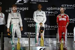 1st place Lewis Hamilton (GBR) Mercedes AMG F1 W07 , 2nd place and new world champion Nico Rosberg (GER) Mercedes AMG Petronas F1 W07 and 3rd place Sebastian Vettel (GER) Scuderia Ferrari SF16-H. 27.11.2016. Formula 1 World Championship, Rd 21, Abu Dhabi Grand Prix, Yas Marina Circuit, Abu Dhabi, Race Day.