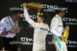 Nico Rosberg (GER) Mercedes AMG F1 celebrates his second position and World Championship with Tony Ross (GBR) Mercedes AMG F1 Race Engineer on the podium. 27.11.2016. Formula 1 World Championship, Rd 21, Abu Dhabi Grand Prix, Yas Marina Circuit, Abu Dhabi, Race Day.