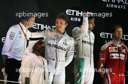 The podium (L to R): Nico Rosberg (GER) Mercedes AMG F1, second and World Champion; Lewis Hamilton (GBR) Mercedes AMG F1, race winner; Sebastian Vettel (GER) Ferrari, third. 27.11.2016. Formula 1 World Championship, Rd 21, Abu Dhabi Grand Prix, Yas Marina Circuit, Abu Dhabi, Race Day.