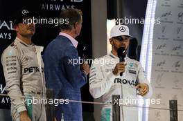 Lewis Hamilton (GBR) Mercedes AMG F1 with David Coulthard (GBR) Red Bull Racing and Scuderia Toro Advisor / Channel 4 F1 Commentator on the podium. 27.11.2016. Formula 1 World Championship, Rd 21, Abu Dhabi Grand Prix, Yas Marina Circuit, Abu Dhabi, Race Day.