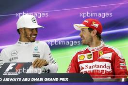 The post race FIA Press Conference (L to R): Lewis Hamilton (GBR) Mercedes AMG F1, race winner; Sebastian Vettel (GER) Ferrari, third. 27.11.2016. Formula 1 World Championship, Rd 21, Abu Dhabi Grand Prix, Yas Marina Circuit, Abu Dhabi, Race Day.