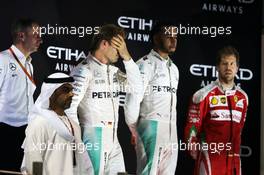 The podium (L to R): Nico Rosberg (GER) Mercedes AMG F1, second and World Champion; Lewis Hamilton (GBR) Mercedes AMG F1, race winner; Sebastian Vettel (GER) Ferrari, third. 27.11.2016. Formula 1 World Championship, Rd 21, Abu Dhabi Grand Prix, Yas Marina Circuit, Abu Dhabi, Race Day.