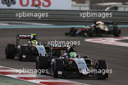 Nico Hulkenberg (GER) Sahara Force India F1 VJM09 leads team mate Sergio Perez (MEX) Sahara Force India F1 VJM09. 27.11.2016. Formula 1 World Championship, Rd 21, Abu Dhabi Grand Prix, Yas Marina Circuit, Abu Dhabi, Race Day.