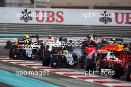 Nico Hulkenberg (GER) Sahara Force India F1 VJM09 at the start of the race as Max Verstappen (NLD) Red Bull Racing RB12 spins. 27.11.2016. Formula 1 World Championship, Rd 21, Abu Dhabi Grand Prix, Yas Marina Circuit, Abu Dhabi, Race Day.