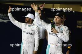 Nico Rosberg (GER) Mercedes AMG F1 celebrates his second position in qualifying parc ferme with team mate Lewis Hamilton (GBR) Mercedes AMG F1. 26.11.2016. Formula 1 World Championship, Rd 21, Abu Dhabi Grand Prix, Yas Marina Circuit, Abu Dhabi, Qualifying Day.