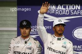 Nico Rosberg (GER) Mercedes AMG Petronas F1 W07 and Lewis Hamilton (GBR) Mercedes AMG F1 W07 . 26.11.2016. Formula 1 World Championship, Rd 21, Abu Dhabi Grand Prix, Yas Marina Circuit, Abu Dhabi, Qualifying Day.