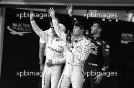 Nico Rosberg (GER) Mercedes AMG F1 with Lewis Hamilton (GBR) Mercedes AMG F1 and Daniel Ricciardo (AUS) Red Bull Racing in qualifying parc ferme. 26.11.2016. Formula 1 World Championship, Rd 21, Abu Dhabi Grand Prix, Yas Marina Circuit, Abu Dhabi, Qualifying Day.