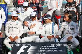 (L to R): Lewis Hamilton (GBR) Mercedes AMG F1; Fernando Alonso (ESP) McLaren; Jenson Button (GBR) McLaren; Felipe Massa (BRA) Williams; and Nico Rosberg (GER) Mercedes AMG F1 at the end of season group drivers group photograph. 27.11.2016. Formula 1 World Championship, Rd 21, Abu Dhabi Grand Prix, Yas Marina Circuit, Abu Dhabi, Race Day.