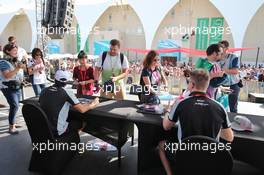 (L to R): Sergio Perez (MEX) Sahara Force India F1 and team mate Nico Hulkenberg (GER) Sahara Force India F1 sign autographs for the fans. 27.11.2016. Formula 1 World Championship, Rd 21, Abu Dhabi Grand Prix, Yas Marina Circuit, Abu Dhabi, Race Day.