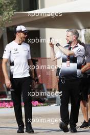 Jenson Button (GBR) McLaren with Steve Cooper (GBR) McLaren Press Officer. 24.11.2016. Formula 1 World Championship, Rd 21, Abu Dhabi Grand Prix, Yas Marina Circuit, Abu Dhabi, Preparation Day.