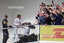 The podium (L to R): Daniel Ricciardo (AUS) Red Bull Racing celebrates his third position with race winner Lewis Hamilton (GBR) Mercedes AMG F1. 23.10.2016. Formula 1 World Championship, Rd 18, United States Grand Prix, Austin, Texas, USA, Race Day.