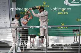 The podium (L to R): Nico Rosberg (GER) Mercedes AMG F1 celebrates with Victoria Vowles (GBR) Mercedes AMG F1 Partner Services Director and race winner Lewis Hamilton (GBR) Mercedes AMG F1. 23.10.2016. Formula 1 World Championship, Rd 18, United States Grand Prix, Austin, Texas, USA, Race Day.