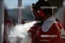 A Ferrari staff member smokes a cigarette. 22.10.2016. Formula 1 World Championship, Rd 18, United States Grand Prix, Austin, Texas, USA, Qualifying Day.