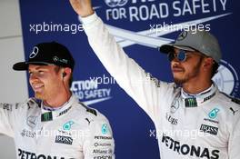 Pole sitter Lewis Hamilton (GBR) Mercedes AMG F1 (Right) celebrates his pole position with second placed team mate Nico Rosberg (GER) Mercedes AMG F1. 22.10.2016. Formula 1 World Championship, Rd 18, United States Grand Prix, Austin, Texas, USA, Qualifying Day.