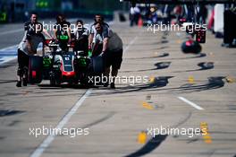 The Haas VF-16 of Romain Grosjean (FRA) Haas F1 Team pushed down the pit lane. 22.10.2016. Formula 1 World Championship, Rd 18, United States Grand Prix, Austin, Texas, USA, Qualifying Day.