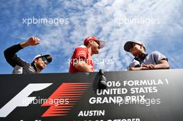 (L to R): Sergio Perez (MEX) Sahara Force India F1 with Sebastian Vettel (GER) Ferrari and Pascal Wehrlein (GER) Manor Racing on the drivers parade. 23.10.2016. Formula 1 World Championship, Rd 18, United States Grand Prix, Austin, Texas, USA, Race Day.