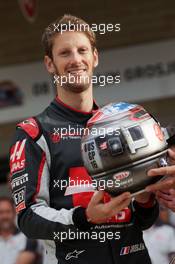 Romain Grosjean (FRA) Haas F1 Team, celebrating his 100th GP with a special helmet livery, at a team photograph. 23.10.2016. Formula 1 World Championship, Rd 18, United States Grand Prix, Austin, Texas, USA, Race Day.