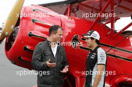 Sergio Perez (MEX) Sahara Force India F1 and Ted Kravitz (GBR) Sky Sports Pitlane Reporter with a biplane. 20.10.2016. Formula 1 World Championship, Rd 18, United States Grand Prix, Austin, Texas, USA, Preparation Day.
