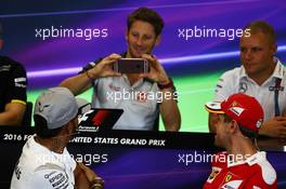 Romain Grosjean (FRA) Haas F1 Team is photographs Lewis Hamilton (GBR) Mercedes AMG F1 in the FIA Press Conference. 20.10.2016. Formula 1 World Championship, Rd 18, United States Grand Prix, Austin, Texas, USA, Preparation Day.
