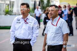 Hiroshi Yasukawa (JPN) Dorna Sports Adviser (Left). 20.10.2016. Formula 1 World Championship, Rd 18, United States Grand Prix, Austin, Texas, USA, Preparation Day.