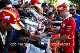 Kimi Raikkonen (FIN) Ferrari signs autographs for the fans. 24.03.2017. Formula 1 World Championship, Rd 1, Australian Grand Prix, Albert Park, Melbourne, Australia, Practice Day.