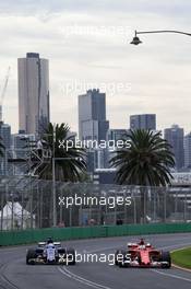 (L to R): Marcus Ericsson (SWE) Sauber C36 andSebastian Vettel (GER) Ferrari SF70H. 24.03.2017. Formula 1 World Championship, Rd 1, Australian Grand Prix, Albert Park, Melbourne, Australia, Practice Day.