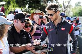 Romain Grosjean (FRA) Haas F1 Team signs autographs for the fans. 24.03.2017. Formula 1 World Championship, Rd 1, Australian Grand Prix, Albert Park, Melbourne, Australia, Practice Day.