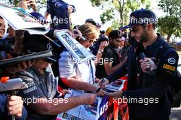 Daniel Ricciardo (AUS) Red Bull Racing signs autographs for the fans. 24.03.2017. Formula 1 World Championship, Rd 1, Australian Grand Prix, Albert Park, Melbourne, Australia, Practice Day.