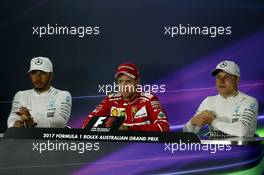 (L to R): Lewis Hamilton (GBR) Mercedes AMG F1; Sebastian Vettel (GER) Ferrari; and Valtteri Bottas (FIN) Mercedes AMG F1 in the FIA Press Conference. 26.03.2017. Formula 1 World Championship, Rd 1, Australian Grand Prix, Albert Park, Melbourne, Australia, Race Day.