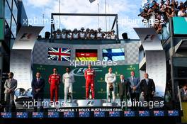 The podium (L to R): Lewis Hamilton (GBR) Mercedes AMG F1, second; Sebastian Vettel (GER) Ferrari, race winner; Valtteri Bottas (FIN) Mercedes AMG F1, third. 26.03.2017. Formula 1 World Championship, Rd 1, Australian Grand Prix, Albert Park, Melbourne, Australia, Race Day.