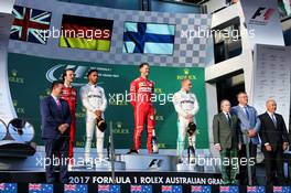 The podium (L to R): Lewis Hamilton (GBR) Mercedes AMG F1, second; Sebastian Vettel (GER) Ferrari, race winner; Valtteri Bottas (FIN) Mercedes AMG F1, third. 26.03.2017. Formula 1 World Championship, Rd 1, Australian Grand Prix, Albert Park, Melbourne, Australia, Race Day.