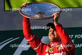 Race winner Sebastian Vettel (GER) Ferrari celebrates on the podium. 26.03.2017. Formula 1 World Championship, Rd 1, Australian Grand Prix, Albert Park, Melbourne, Australia, Race Day.