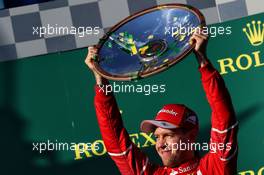 Race winner Sebastian Vettel (GER) Ferrari celebrates on the podium. 26.03.2017. Formula 1 World Championship, Rd 1, Australian Grand Prix, Albert Park, Melbourne, Australia, Race Day.