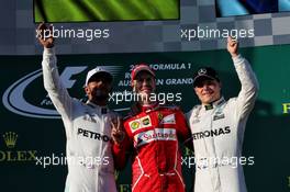 The podium (L to R): Lewis Hamilton (GBR) Mercedes AMG F1, second; Sebastian Vettel (GER) Ferrari, race winner; Valtteri Bottas (FIN) Mercedes AMG F1, third. 26.03.2017. Formula 1 World Championship, Rd 1, Australian Grand Prix, Albert Park, Melbourne, Australia, Race Day.