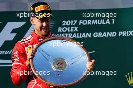 Race winner Sebastian Vettel (GER) Ferrari celebrates on the podium. 26.03.2017. Formula 1 World Championship, Rd 1, Australian Grand Prix, Albert Park, Melbourne, Australia, Race Day.