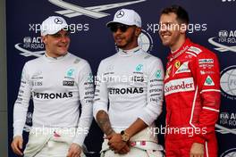 Qualifying top three in parc ferme (L to R): Valtteri Bottas (FIN) Mercedes AMG F1, third; Lewis Hamilton (GBR) Mercedes AMG F1, pole position; Sebastian Vettel (GER) Ferrari, second. 25.03.2017. Formula 1 World Championship, Rd 1, Australian Grand Prix, Albert Park, Melbourne, Australia, Qualifying Day.