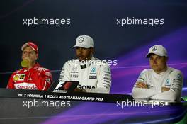 The post qualifying FIA Press Conference (L to R): Sebastian Vettel (GER) Ferrari; Lewis Hamilton (GBR) Mercedes AMG F1; Valtteri Bottas (FIN) Mercedes AMG F1. 25.03.2017. Formula 1 World Championship, Rd 1, Australian Grand Prix, Albert Park, Melbourne, Australia, Qualifying Day.