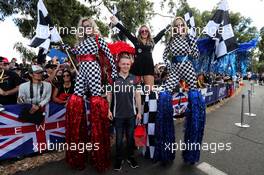 Kevin Magnussen (DEN) Haas F1 Team with girls on stilts. 23.03.2017. Formula 1 World Championship, Rd 1, Australian Grand Prix, Albert Park, Melbourne, Australia, Preparation Day.