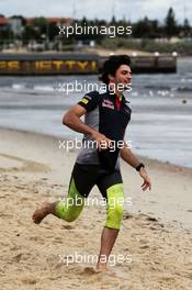 Carlos Sainz Jr (ESP) Scuderia Toro Rosso on St Kilda Beach with the St Kilda Lifesaving Club. 22.03.2017. Formula 1 World Championship, Rd 1, Australian Grand Prix, Albert Park, Melbourne, Australia, Preparation Day.