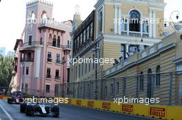 Lewis Hamilton (GBR) Mercedes AMG F1 W08 leads Sebastian Vettel (GER) Ferrari SF70H. 25.06.2017. Formula 1 World Championship, Rd 8, Azerbaijan Grand Prix, Baku Street Circuit, Azerbaijan, Race Day.