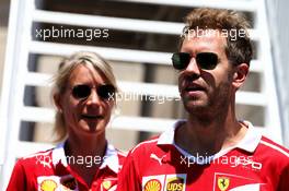 Sebastian Vettel (GER) Ferrari with Britta Roeske (AUT) Ferrari Press Officer. 24.06.2017. Formula 1 World Championship, Rd 8, Azerbaijan Grand Prix, Baku Street Circuit, Azerbaijan, Qualifying Day.
