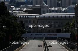 Kevin Magnussen (DEN) Haas VF-17 and Lance Stroll (CDN) Williams FW40. 24.06.2017. Formula 1 World Championship, Rd 8, Azerbaijan Grand Prix, Baku Street Circuit, Azerbaijan, Qualifying Day.