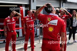 Ferrari mechanics stretch. 27.08.2017. Formula 1 World Championship, Rd 12, Belgian Grand Prix, Spa Francorchamps, Belgium, Race Day.