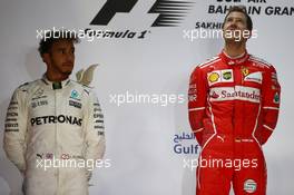 2nd place Lewis Hamilton (GBR) Mercedes AMG F1 W08 and 1st place Sebastian Vettel (GER) Ferrari SF70H. 16.04.2017. Formula 1 World Championship, Rd 3, Bahrain Grand Prix, Sakhir, Bahrain, Race Day.