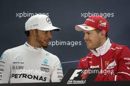 (L to R): Lewis Hamilton (GBR) Mercedes AMG F1 and Sebastian Vettel (GER) Ferrari in the FIA Press Conference. 16.04.2017. Formula 1 World Championship, Rd 3, Bahrain Grand Prix, Sakhir, Bahrain, Race Day.