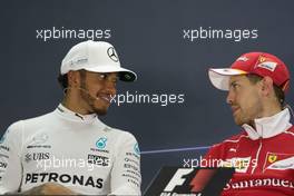 (L to R): Lewis Hamilton (GBR) Mercedes AMG F1 and Sebastian Vettel (GER) Ferrari in the FIA Press Conference. 16.04.2017. Formula 1 World Championship, Rd 3, Bahrain Grand Prix, Sakhir, Bahrain, Race Day.