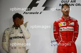 2nd place Lewis Hamilton (GBR) Mercedes AMG F1 W08 and 1st place Sebastian Vettel (GER) Ferrari SF70H. 16.04.2017. Formula 1 World Championship, Rd 3, Bahrain Grand Prix, Sakhir, Bahrain, Race Day.