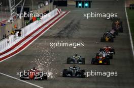 Sebastian Vettel (GER) Ferrari SF70H leads Valtteri Bottas (FIN) Mercedes AMG F1 W08 at the restart. 16.04.2017. Formula 1 World Championship, Rd 3, Bahrain Grand Prix, Sakhir, Bahrain, Race Day.