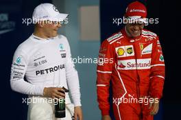 Valtteri Bottas (FIN) Mercedes AMG F1 W08 and Sebastian Vettel (GER) Ferrari. 15.04.2017. Formula 1 World Championship, Rd 3, Bahrain Grand Prix, Sakhir, Bahrain, Qualifying Day.